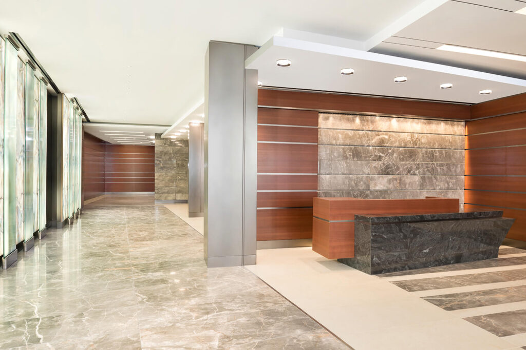 1000 F Street Interior Building's lobby with wood walls and marble details